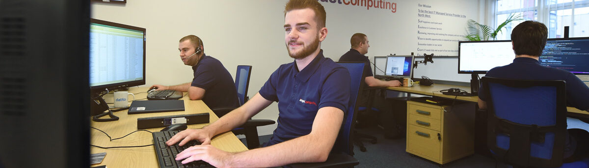 Impact Computing Team at workstations